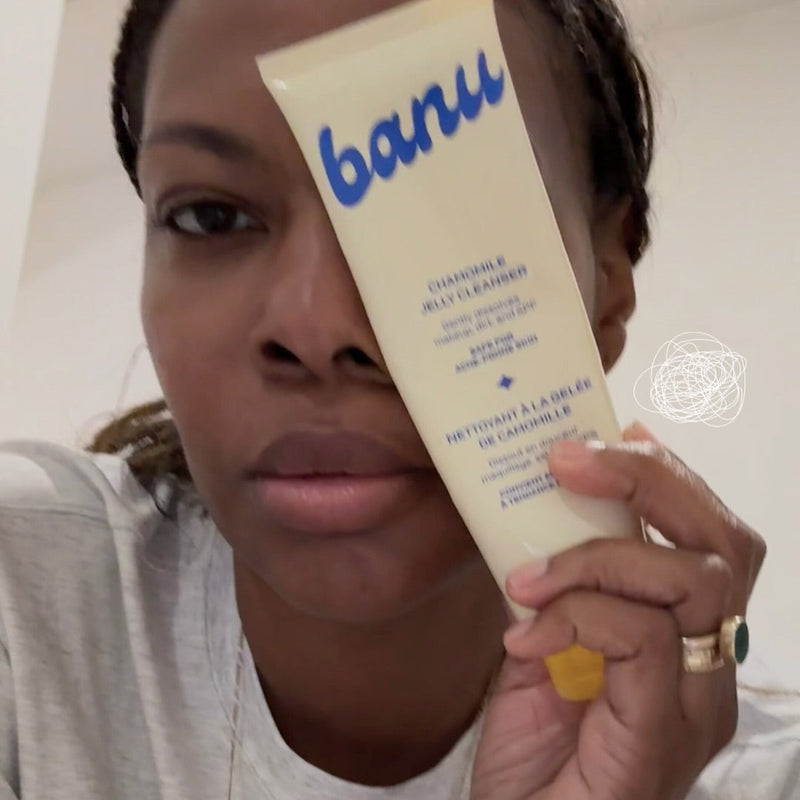 woman holding chamomile jelly cleanser over left half of her face